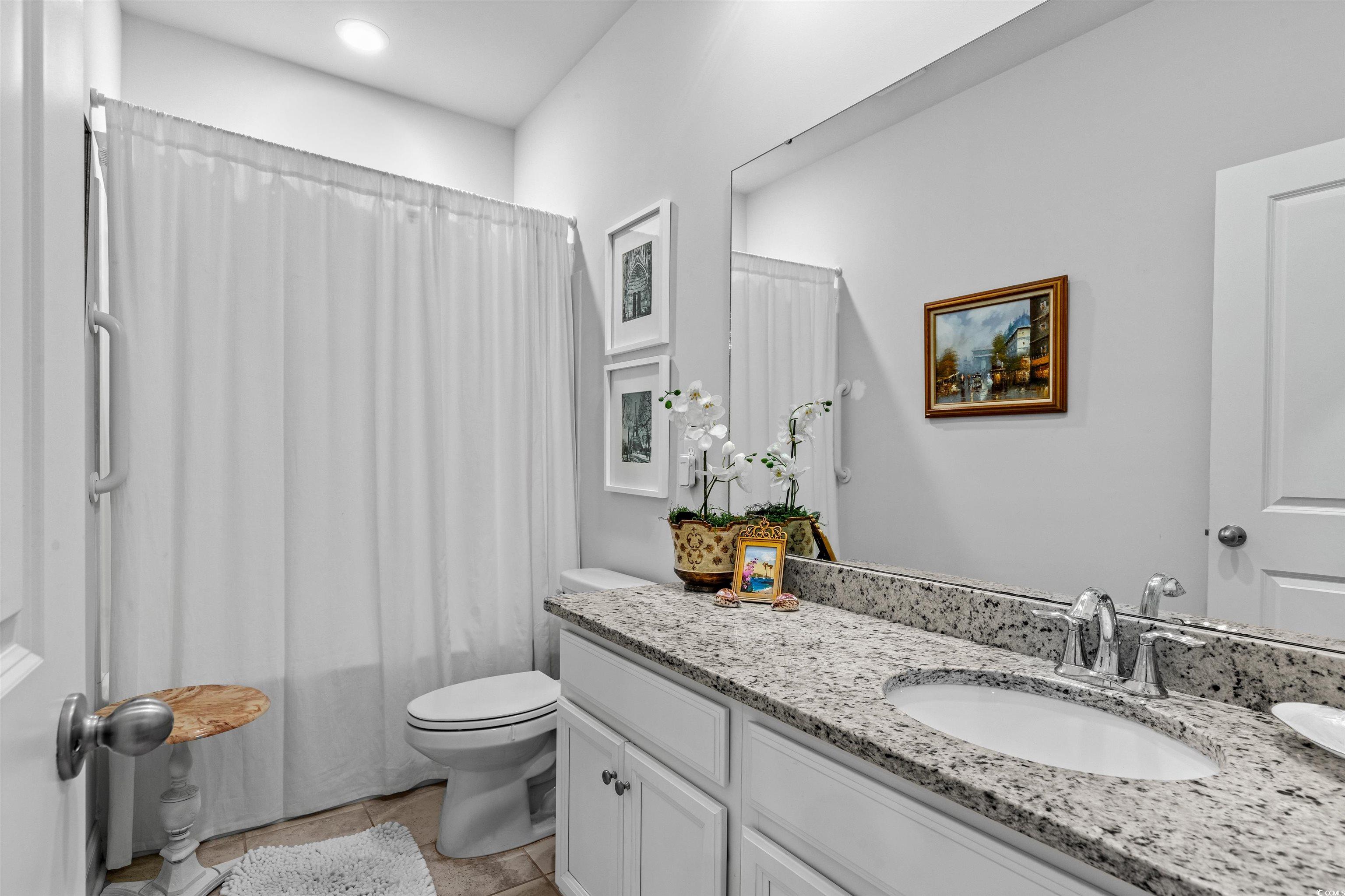 2464 Rock Dove Road Myrtle Beach, SC 29577 - Photo 22 of 34 Bathroom featuring vanity, tile patterned floors, and toilet