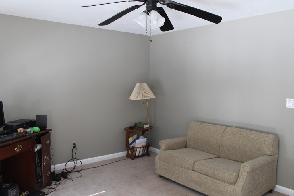 124 Mashapaug Road Sturbridge, MA 01566 - Photo 11 of 30 a living room with furniture and a ceiling fan