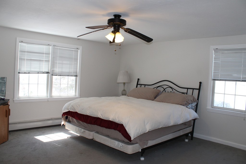 124 Mashapaug Road Sturbridge, MA 01566 - Photo 13 of 30 a bedroom with a bed and window