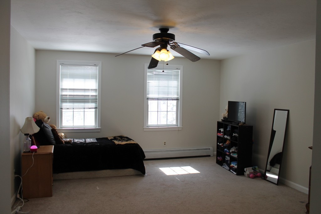 124 Mashapaug Road Sturbridge, MA 01566 - Photo 16 of 30 a living room with furniture and a window