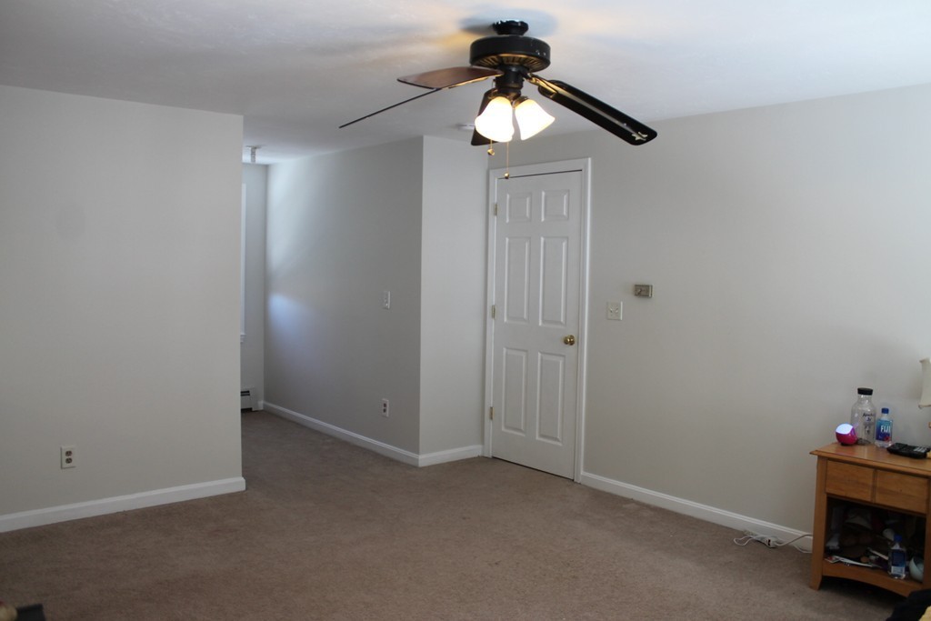 124 Mashapaug Road Sturbridge, MA 01566 - Photo 17 of 30 an empty room with windows and fan