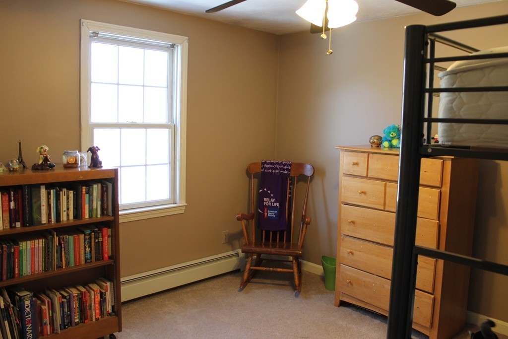 124 Mashapaug Road Sturbridge, MA 01566 - Photo 20 of 30 a view of room with furniture and a book shelf