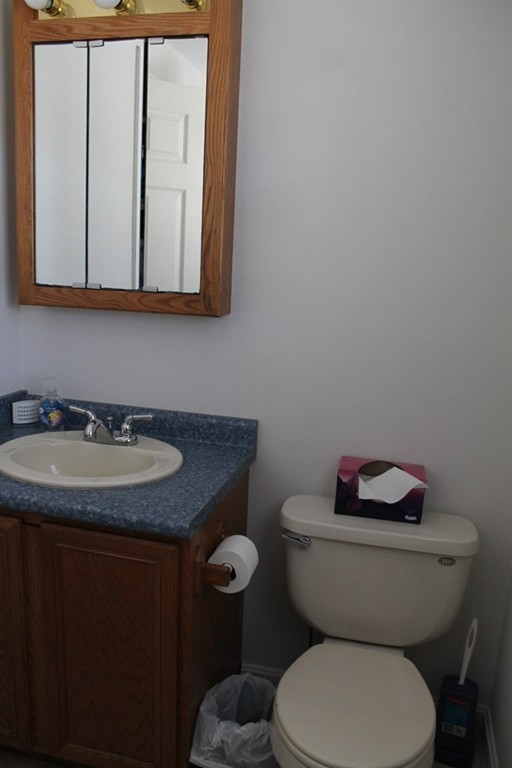 124 Mashapaug Road Sturbridge, MA 01566 - Photo 22 of 30 a bathroom with a granite countertop toilet sink and mirror