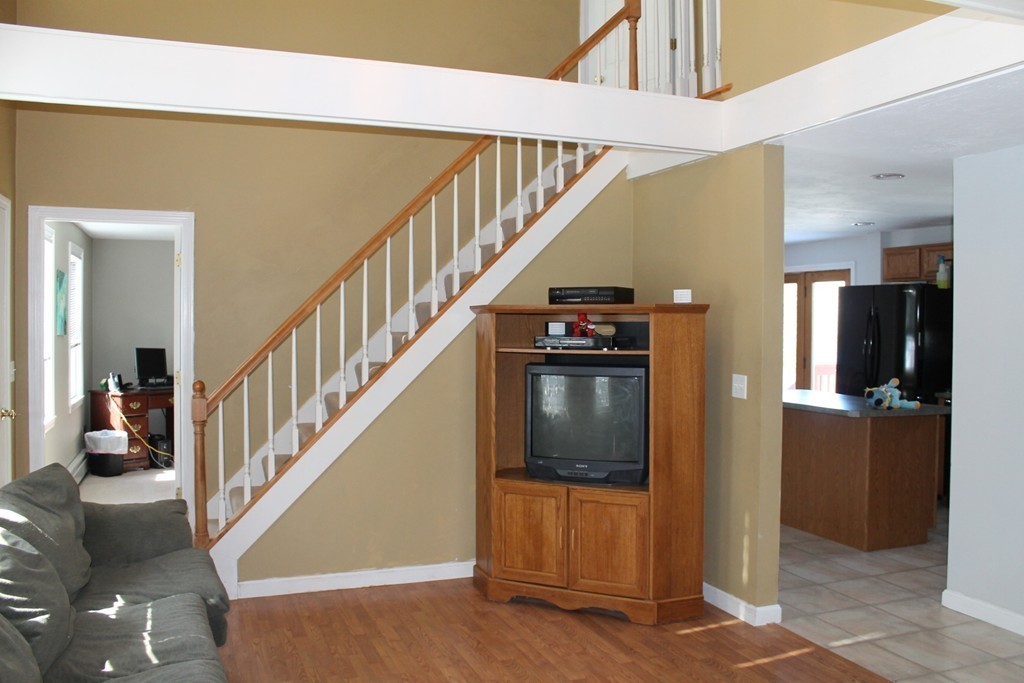 124 Mashapaug Road Sturbridge, MA 01566 - Photo 7 of 30 a view of entryway and hall with wooden floor