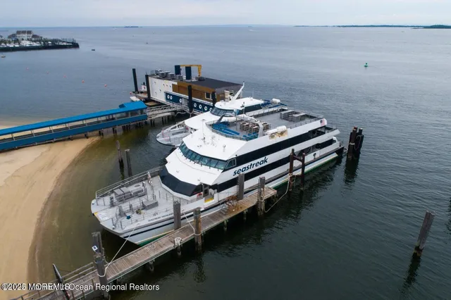 a white wooden table sitting inside of a room