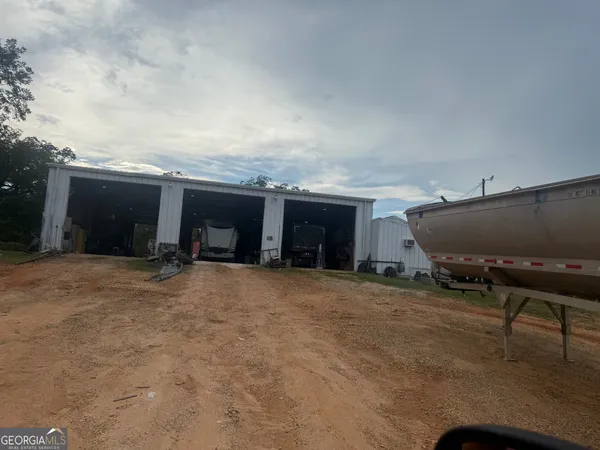 a view of a house with backyard and porch