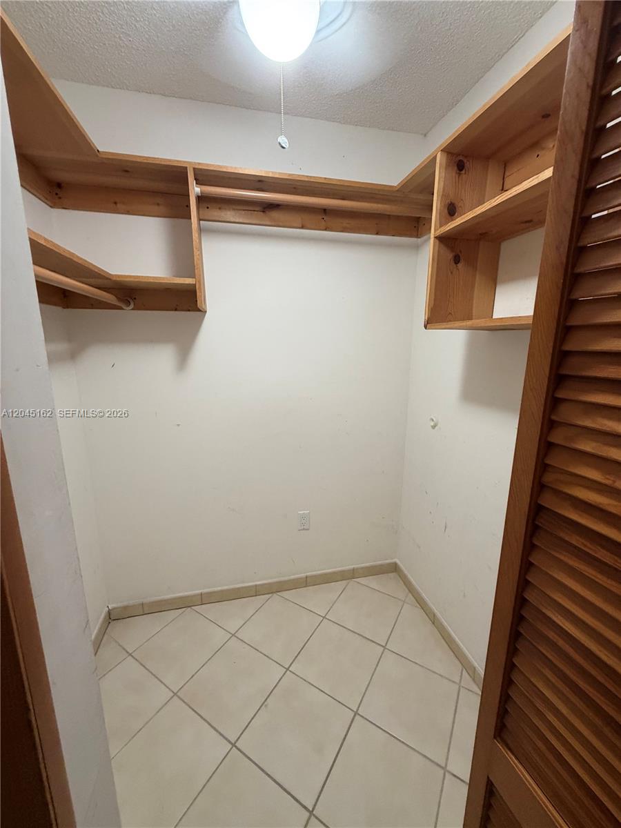 3262 Southwest 139th Place Miami, FL 33175 - Photo 15 of 36 a view of a room with racks on the wall