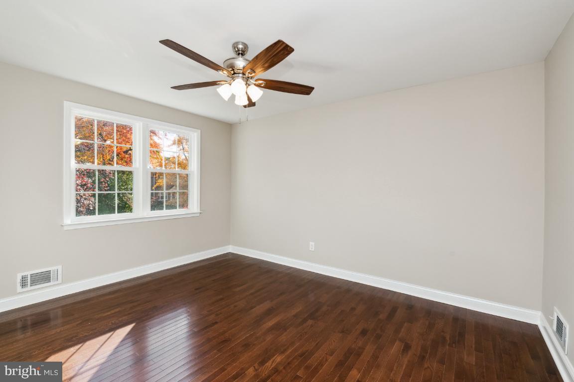124 Brandon Road Baltimore, MD 21212 - Photo 16 of 25 Primary bedroom has ceiling fan and light