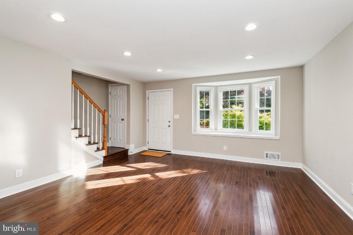 124 Brandon Road Baltimore, MD 21212 - Photo 3 of 25 Living room recessed lighting, engineered floors