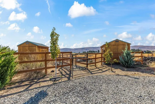 a view of a chairs and table in the patio