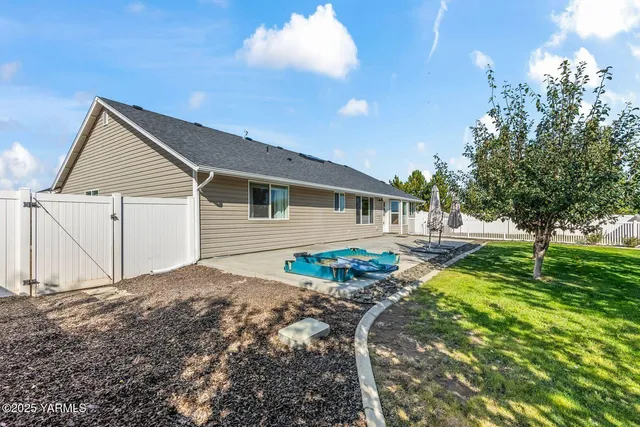 a house view with a backyard space