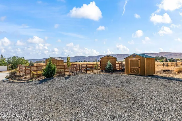 a view of a parking space in front of a building