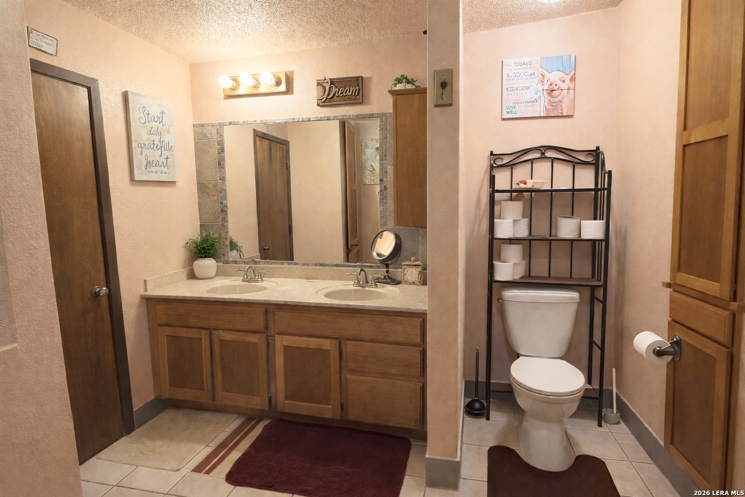 116 Debra Lane Hunt, TX 78024 - Photo 17 of 34 a bathroom with a toilet a sink and mirror