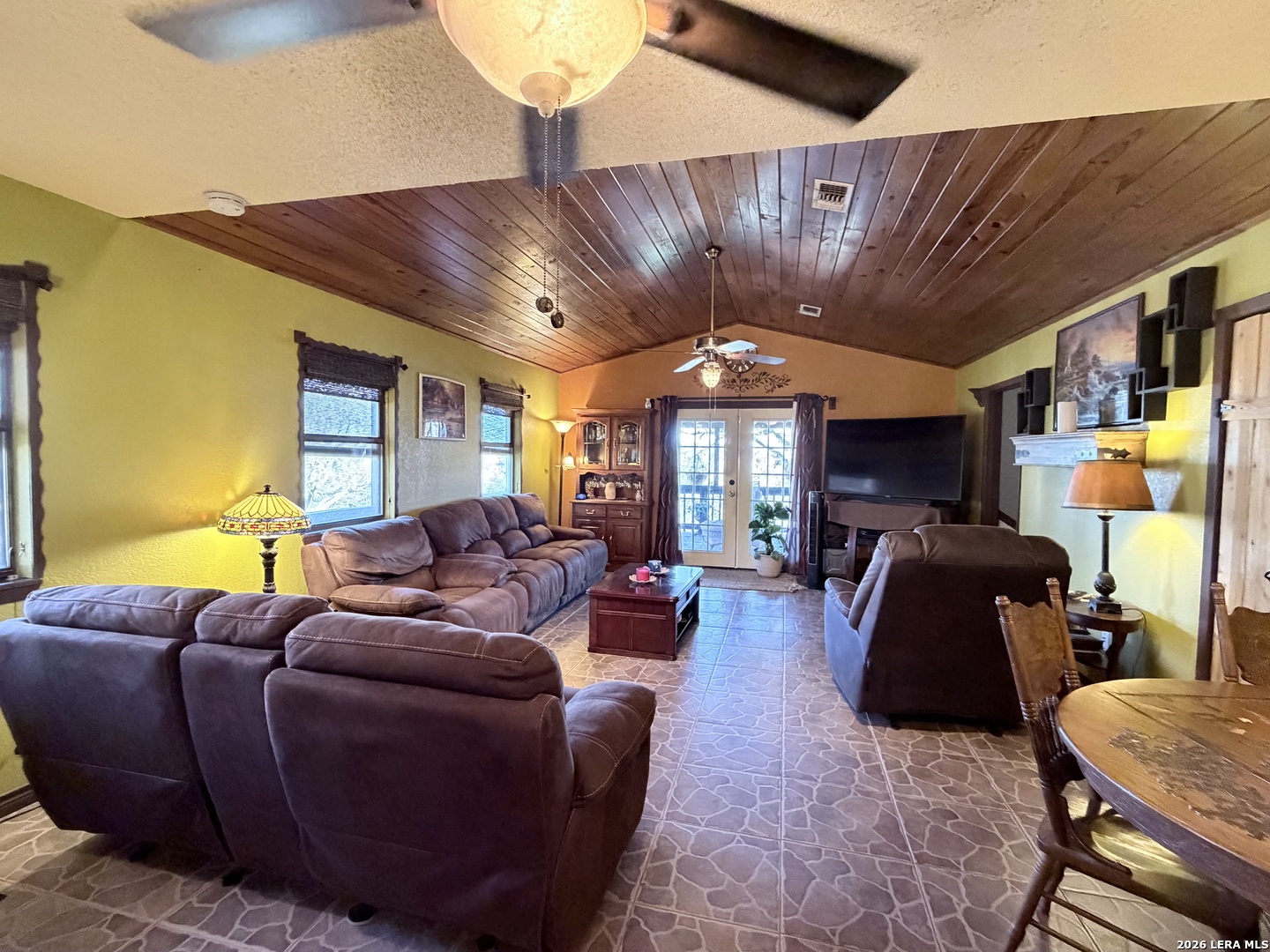 116 Debra Lane Hunt, TX 78024 - Photo 2 of 34 a living room with furniture a ceiling fan and a window