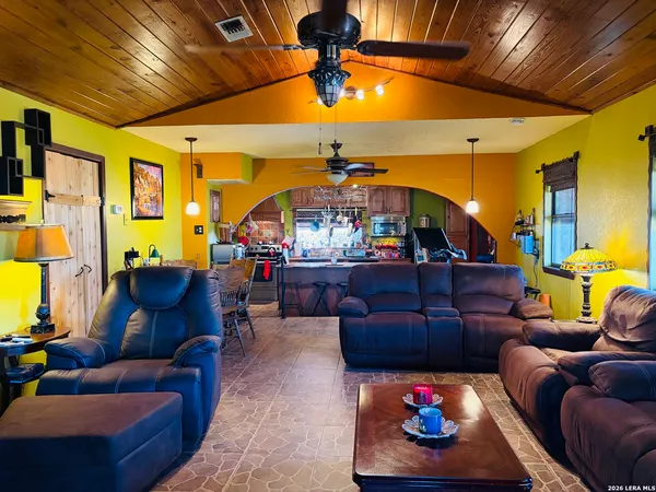 a living room with furniture and a rug