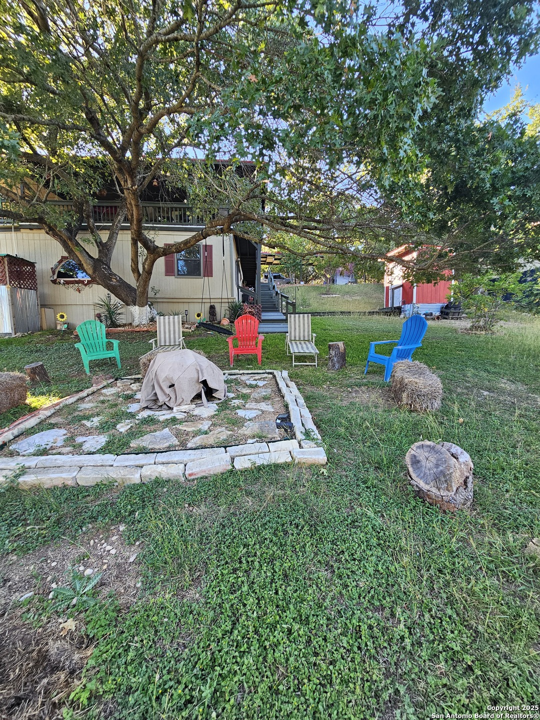116 Debra Lane Hunt, TX 78024 - Photo 31 of 34 a front view of a house with garden and trees