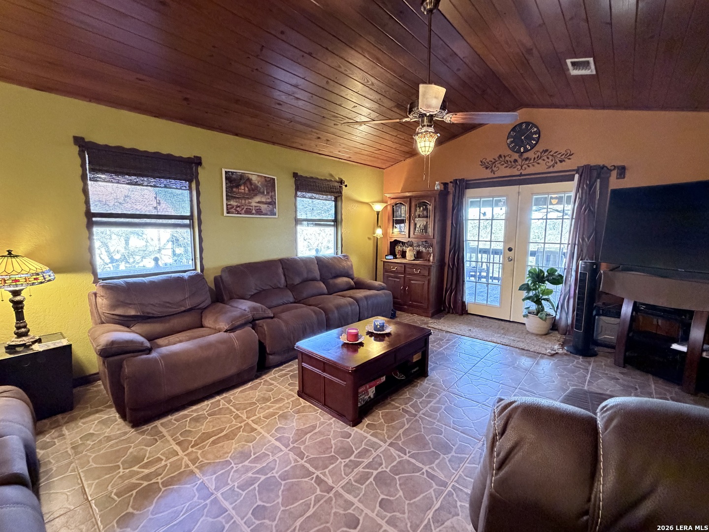 116 Debra Lane Hunt, TX 78024 - Photo 4 of 34 a living room with furniture a fireplace and a flat screen tv
