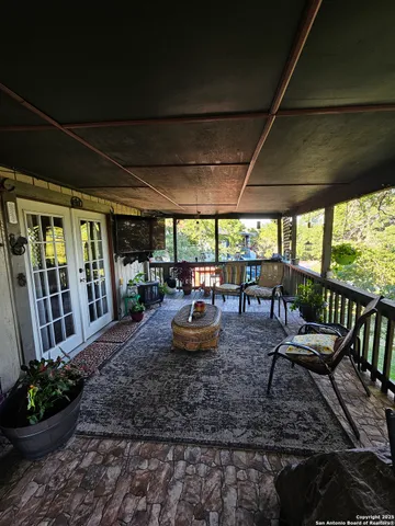 a view of a house with wooden fence