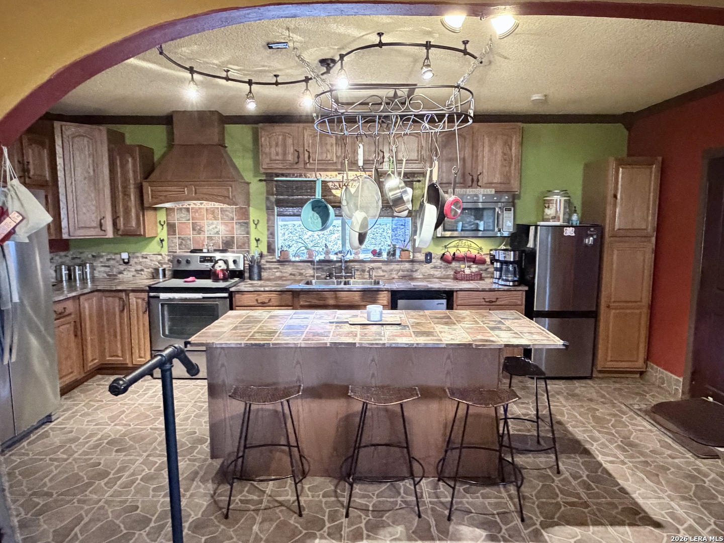 116 Debra Lane Hunt, TX 78024 - Photo 5 of 34 a view of a dining room with furniture a chandelier and wooden floor