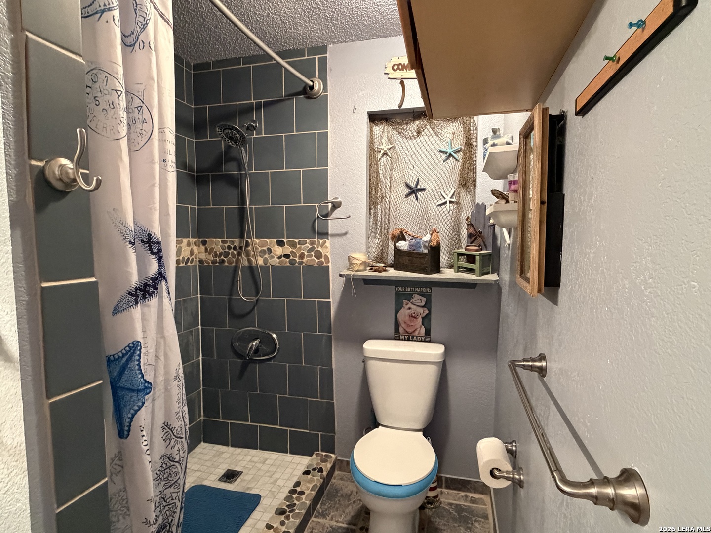 116 Debra Lane Hunt, TX 78024 - Photo 10 of 34 a bathroom with a toilet and shower