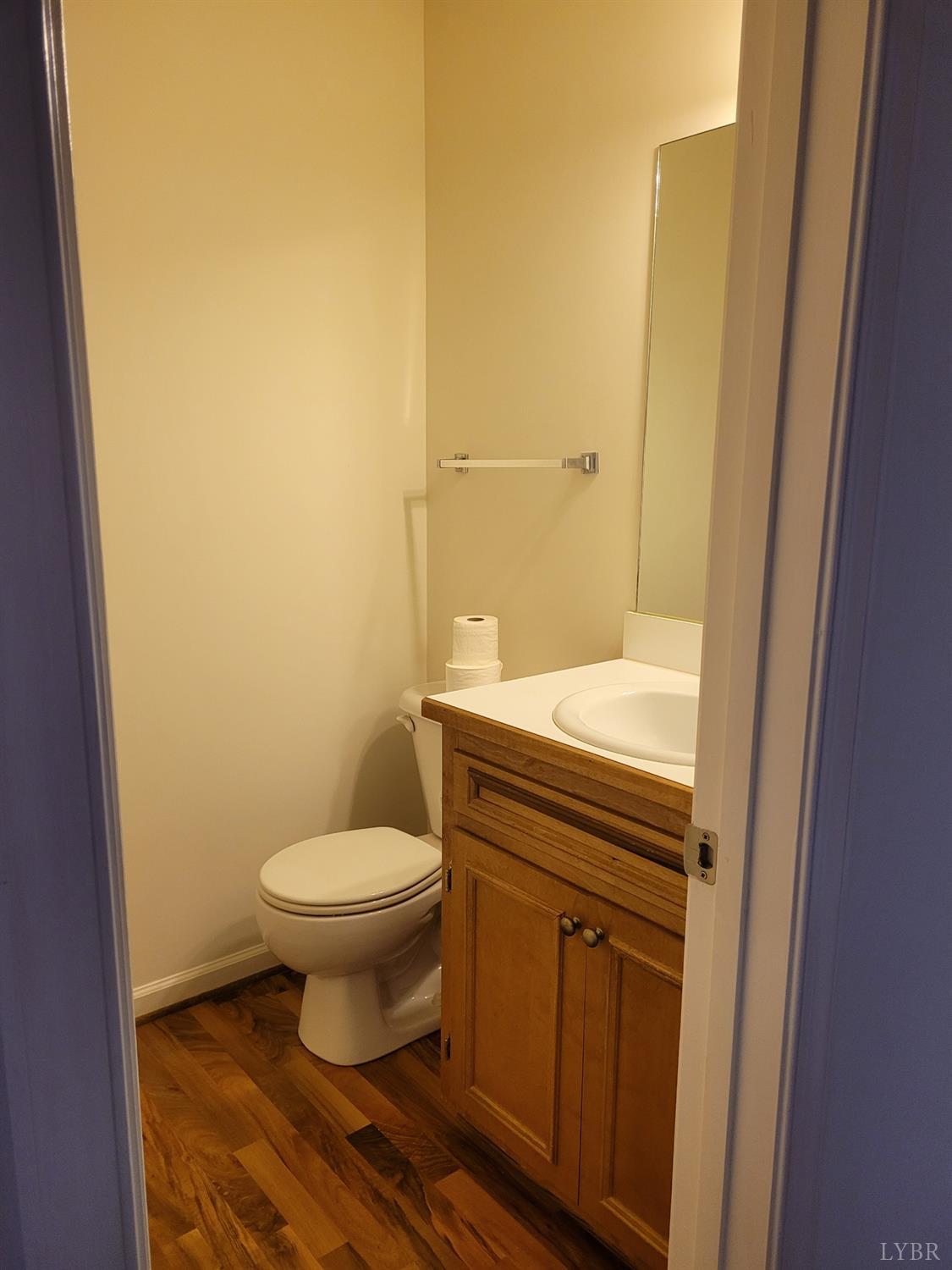 716 Leesville Road, Unit 603 Lynchburg, VA 24502 - Photo 4 of 13 a bathroom with a granite countertop toilet and a sink