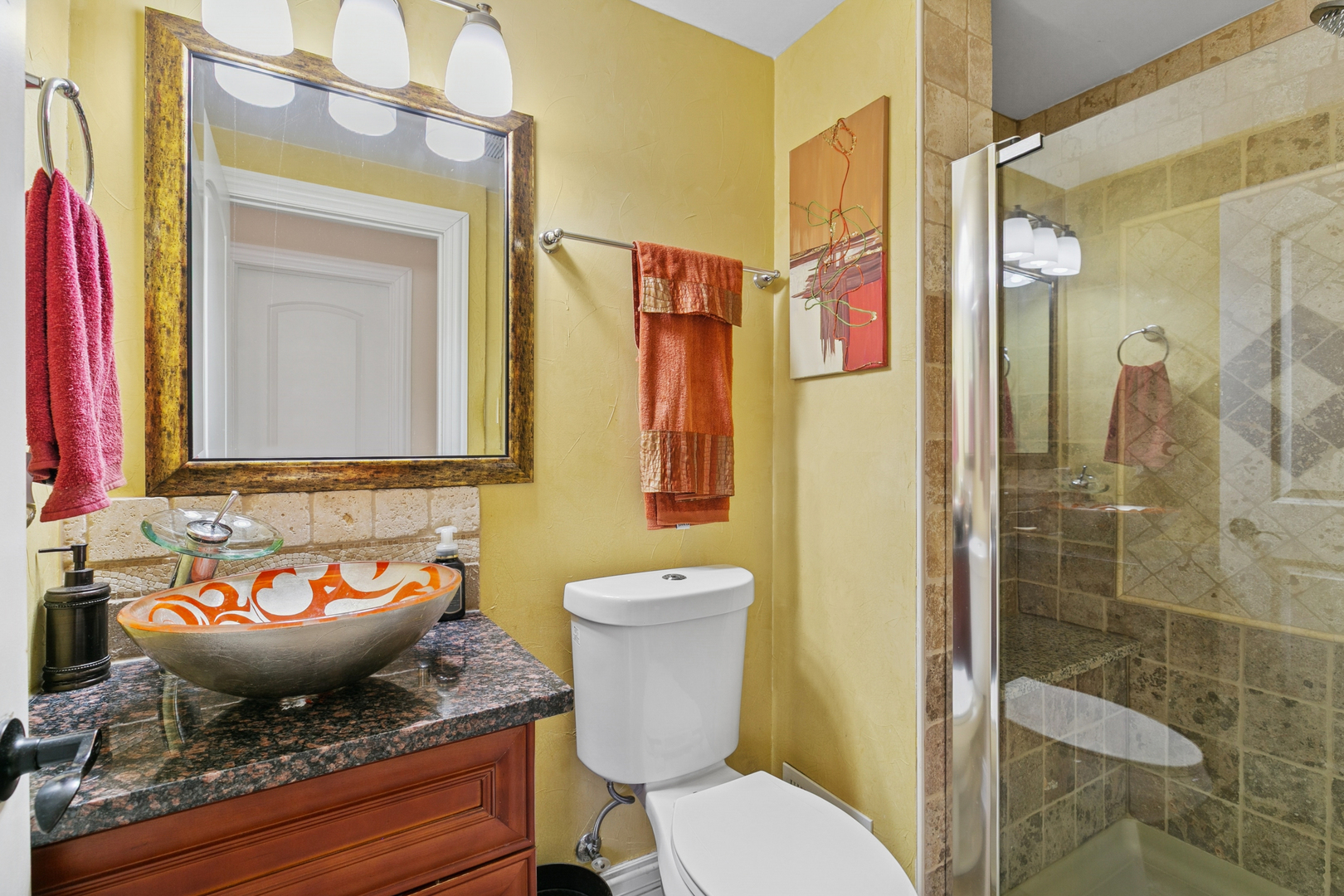 6306 Beaver Dam Road Matteson, IL 60443 - Photo 18 of 20 a bathroom with a toilet a sink and a mirror