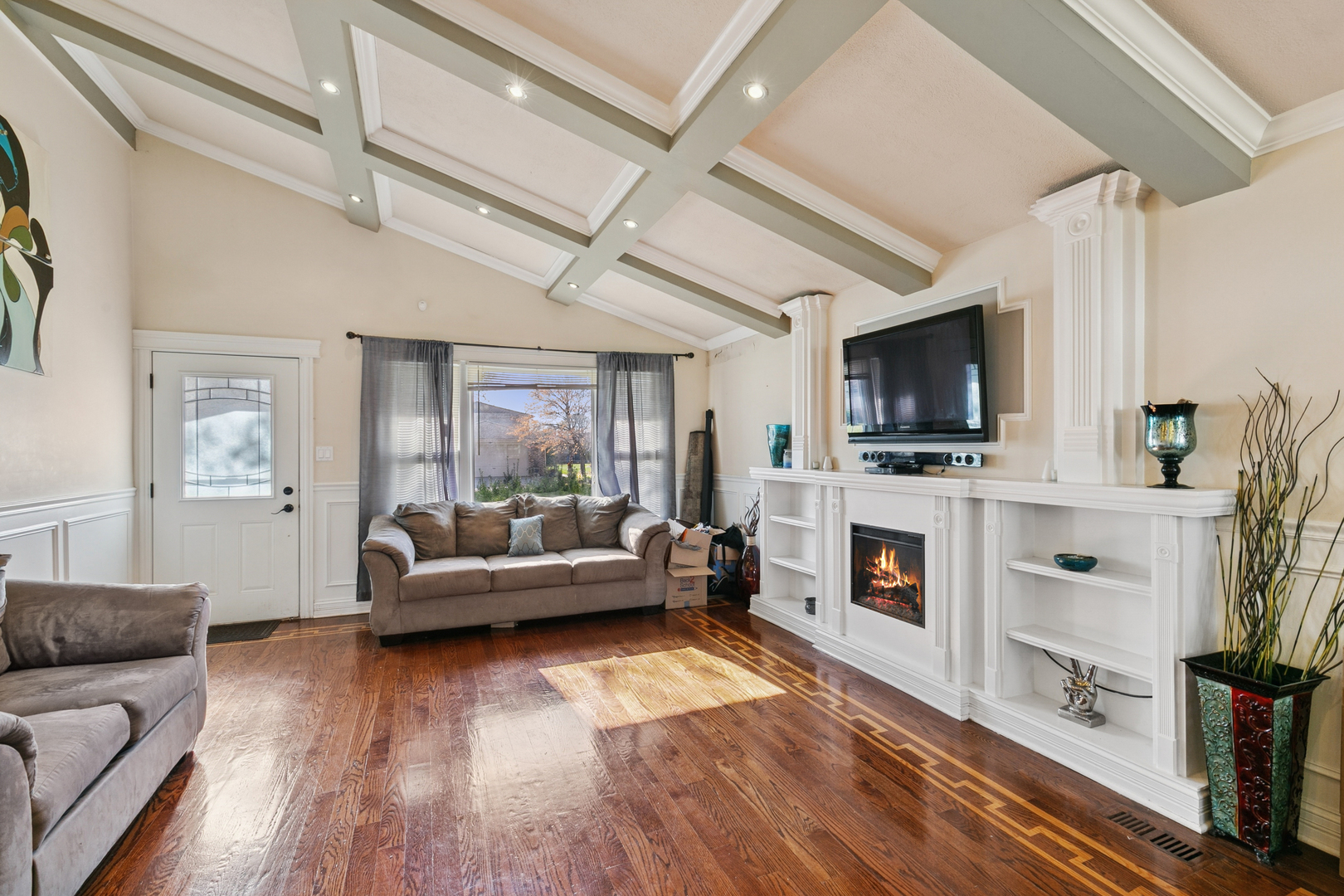 6306 Beaver Dam Road Matteson, IL 60443 - Photo 10 of 20 a living room with furniture a flat screen tv and a fireplace