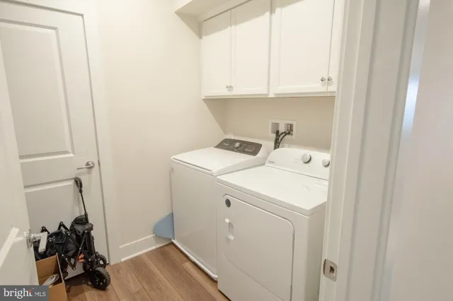 a view of storage and utility room with washer and dryer