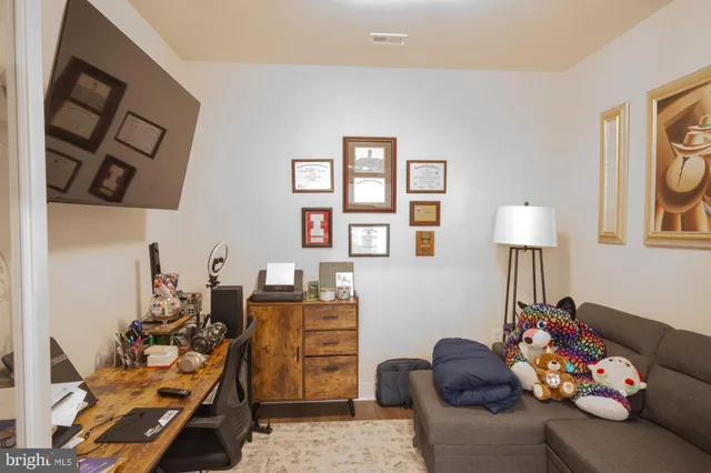 a bedroom with furniture and a couch