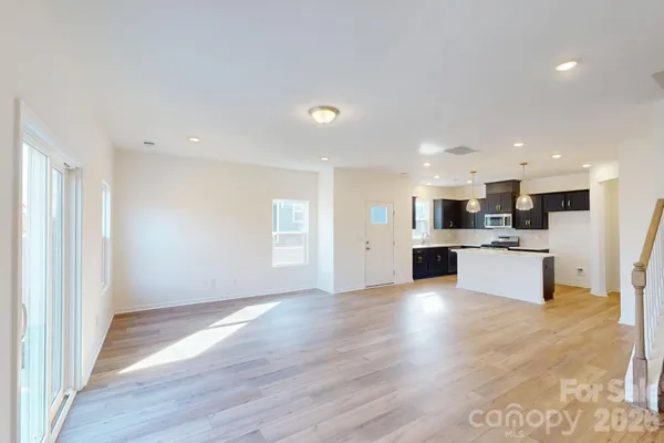 a view of kitchen with wooden floor
