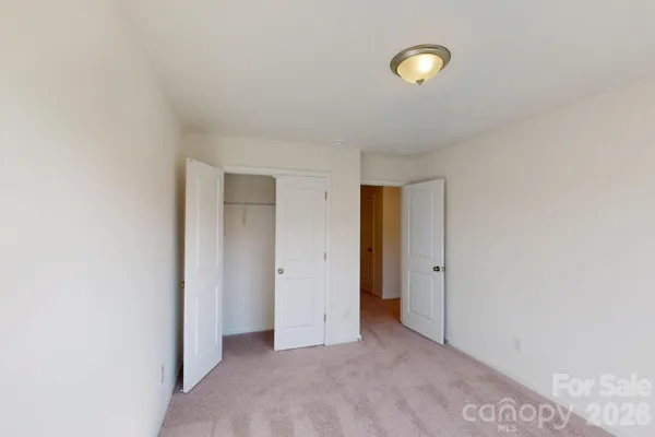 a view of a room with window and closet area