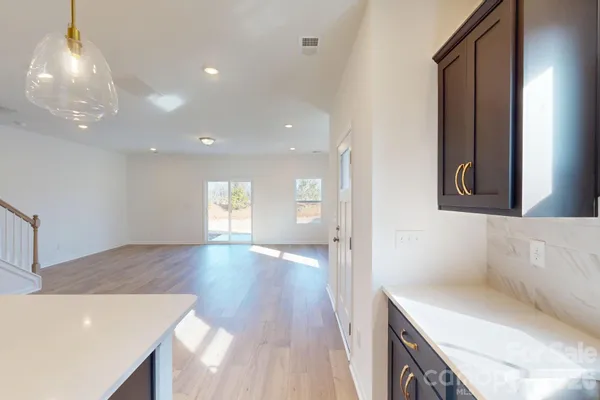 a view of a kitchen cabinets and a wooden floor