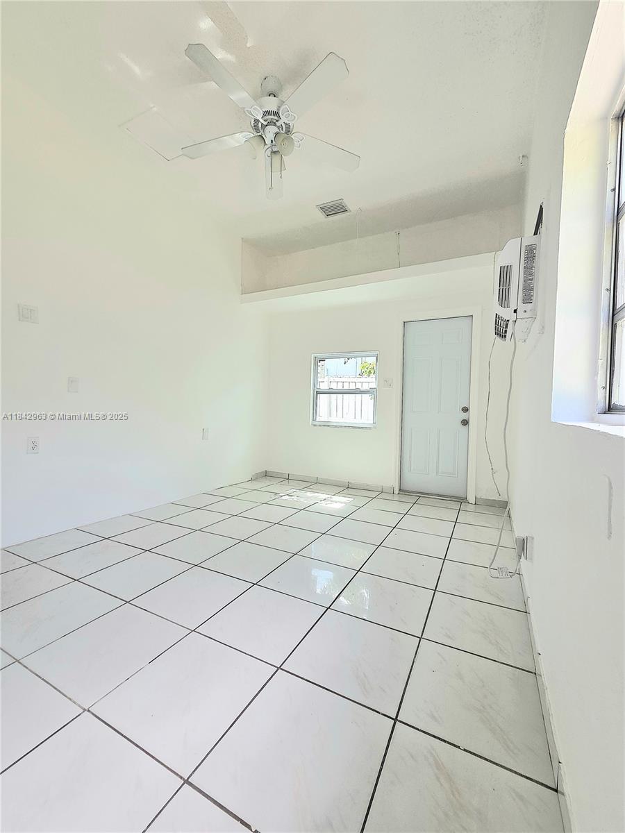Allapattah Miami, FL 33142 - Photo 5 of 9 a view of a livingroom with white tiles