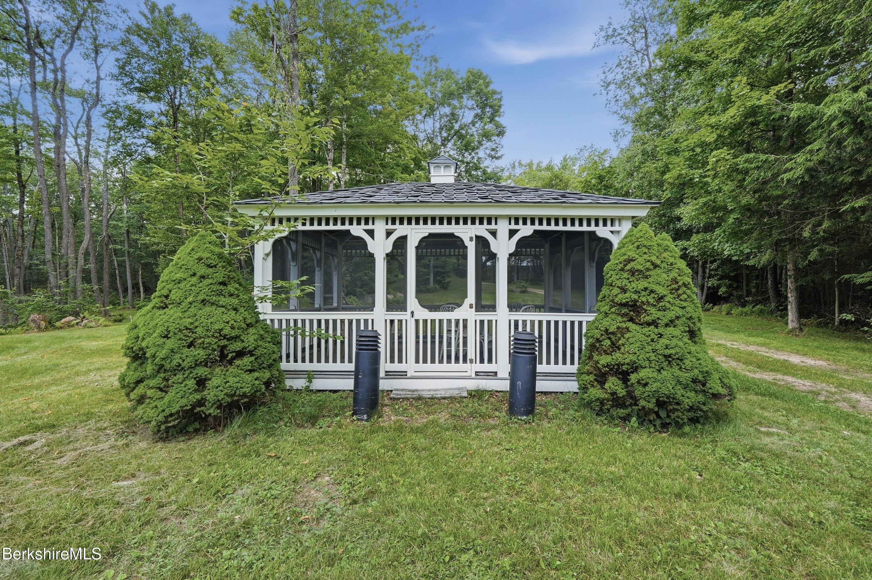 68 Curtin Road Peru, MA 01235 - Photo 19 of 38 a view of a house with a garden