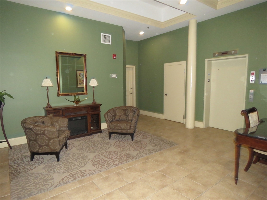 61 Market Street, Unit 2B Lowell, MA 01852 - Photo 16 of 20 a living room with furniture