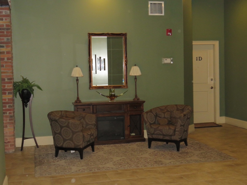 61 Market Street, Unit 2B Lowell, MA 01852 - Photo 17 of 20 a living room with furniture and a sink