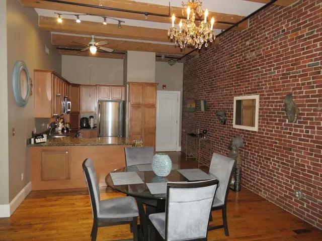 a dining room with furniture and window
