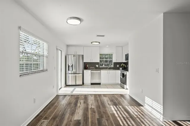 a view of kitchen with wooden floor