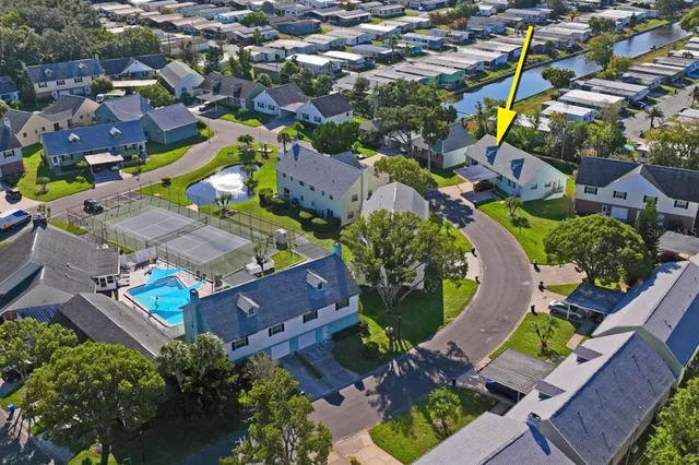 an aerial view of residential houses with outdoor space