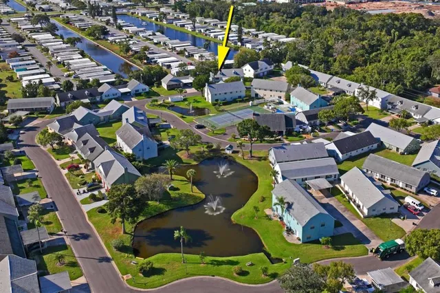 an aerial view of houses with yard