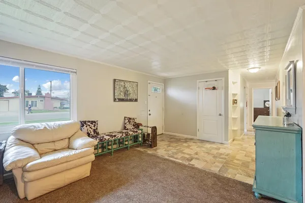 a living room with furniture and a area