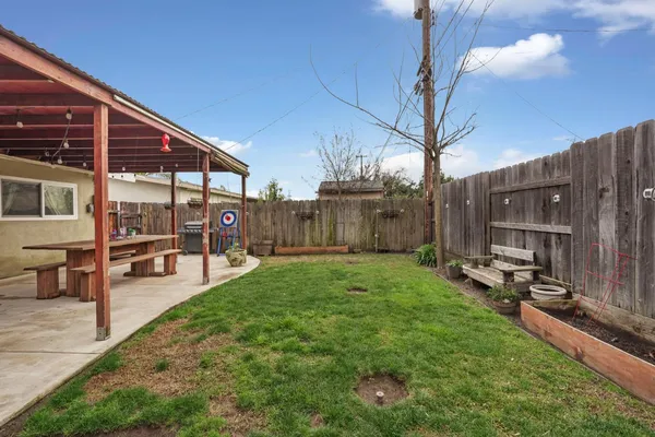 a view of a backyard with sitting area
