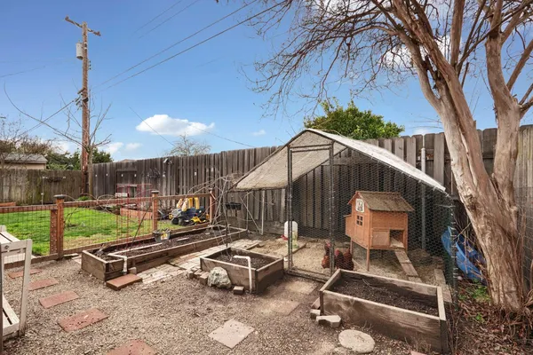 a backyard of a house with outdoor seating