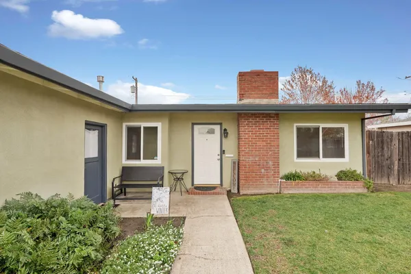 a front view of a house with garden