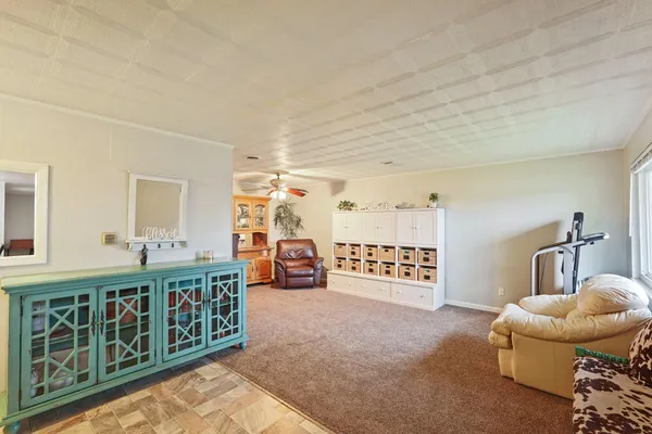 a view of a livingroom with furniture and windows