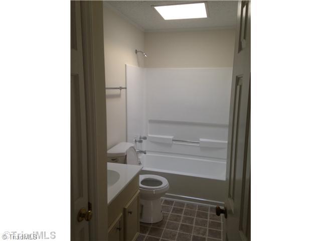7107 North River Road Oak Ridge, NC 27310 - Photo 10 of 16 Bath. Hall Bath with Skylight