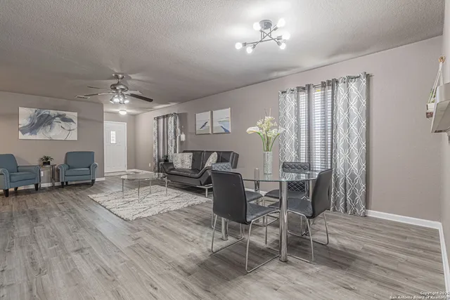 a view of a livingroom with furniture and a window