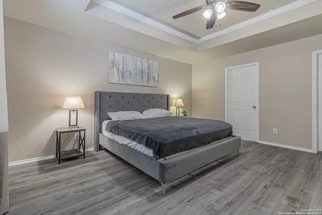 a spacious bedroom with a bed and a couch