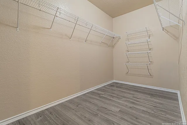 a view of a room with racks on the wall