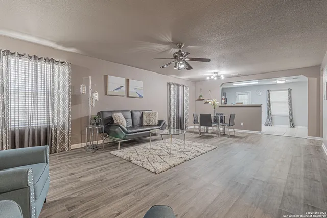 a living room with furniture and a table